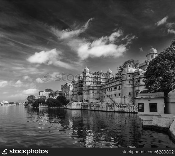 Romantic India luxury tourism concept background - Udaipur City Palace and Lake Pichola. Udaipur, Rajasthan, India. Black and white version