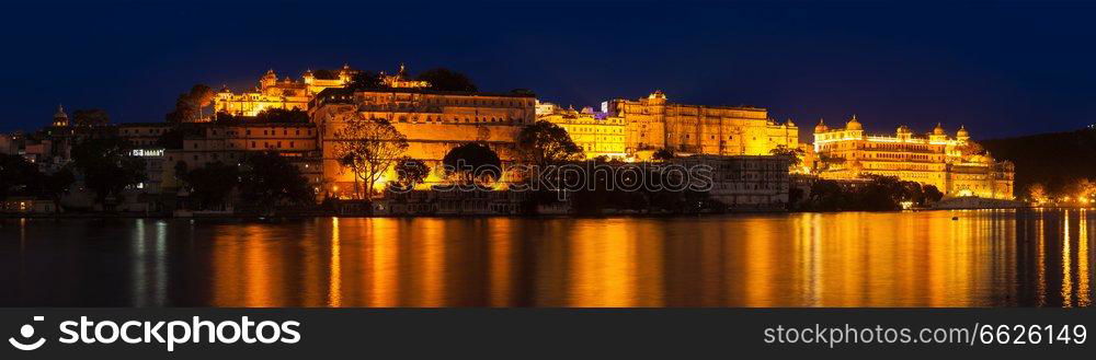 Romantic luxury India travel tourism - City Palace complex on Lake Pichola in twilight, Udaipur, Rajasthan, India. City Palace, Udaipur, Rajasth