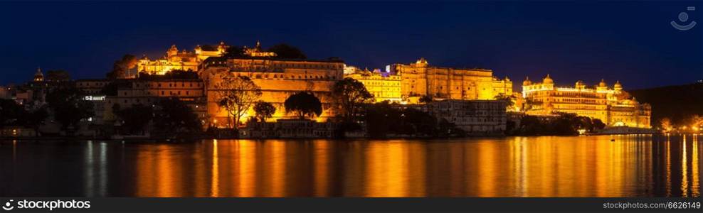 Romantic luxury India travel tourism - City Palace complex on Lake Pichola in twilight, Udaipur, Rajasthan, India. City Palace, Udaipur, Rajasth