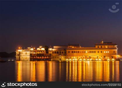 Romantic luxury India travel tourism - Lake Palace (Jag Niwas) complex on Lake Pichola in twilight, Udaipur, Rajasthan, India
