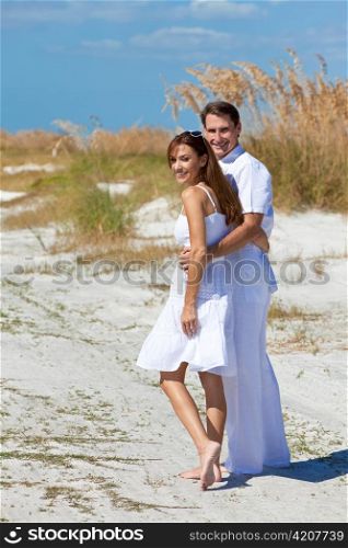 Romantic Man and Woman Couple Walking on An Empty Beach