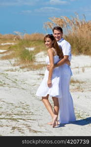 Romantic Man and Woman Couple Walking on An Empty Beach