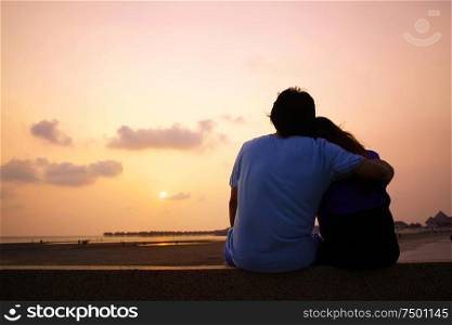 Romantic Mature Couple Enjoying at Sunset on the Beach in Sepang,Malaysia
