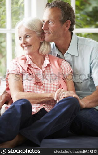 Romantic Middle Aged Couple Looking Out Of Window