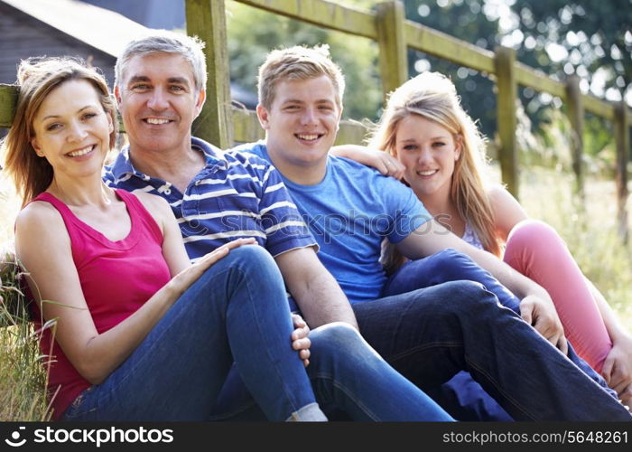 Romantic Middle Aged Couple Relaxing On Walk In Countryside