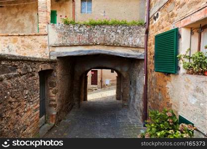 Romantic narrow street and balcony in Montepulciano, Tuscany, Italy. Tuscan architecture. Romantic narrow street and balcony in Montepulciano, Tuscany, Italy.