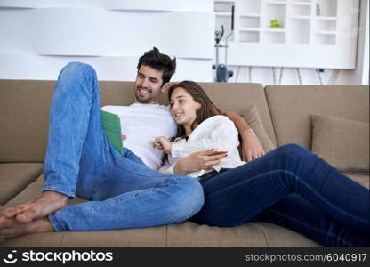 romantic relaxed young couple at modern home using tablet computer