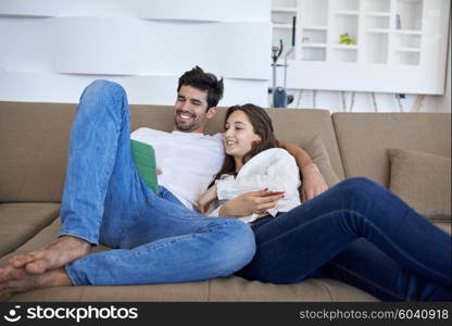 romantic relaxed young couple at modern home using tablet computer