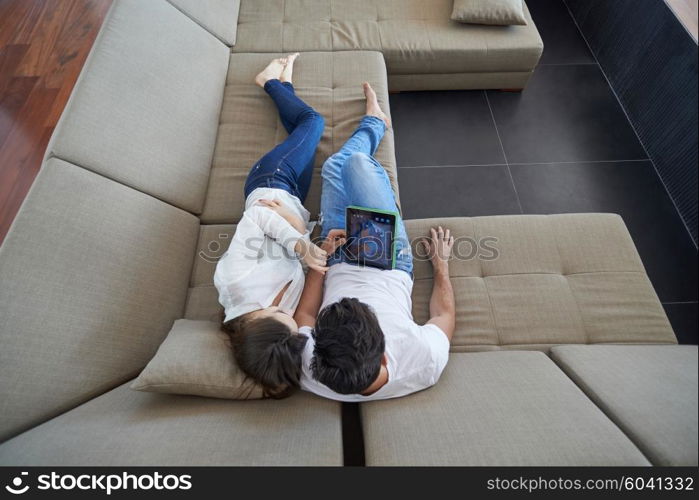 romantic relaxed young couple at modern home using tablet computer