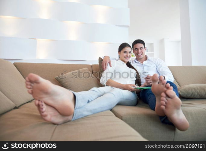 romantic relaxed young couple at modern home using tablet computer