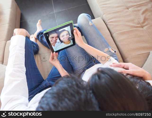 romantic relaxed young couple at modern home using tablet computer