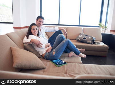 romantic relaxed young couple at modern home using tablet computer