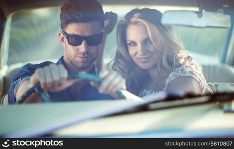 Romantic scene inside the retro auto