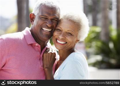 Romantic Senior Couple Hugging In Street