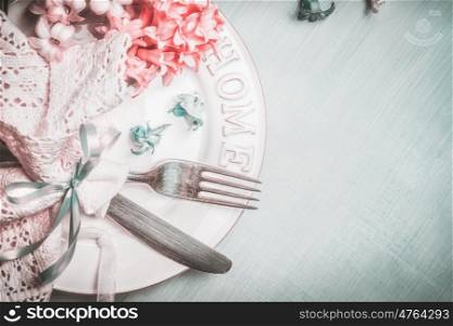 Romantic spring table setting in blue pink pastel color, top view, border