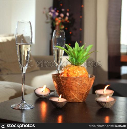 Romantic still-life with wine glasses for champagne and candles