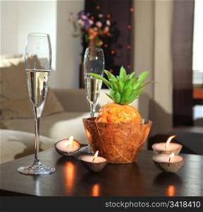 Romantic still-life with wine glasses for champagne and candles
