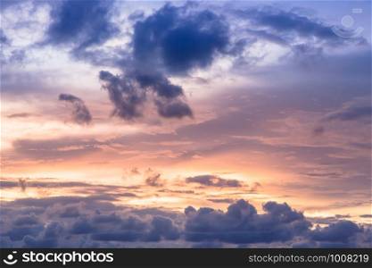 Romantic sunset sky with fluffy clouds and beautiful heavy weather landscape for use as background images and illustrations.