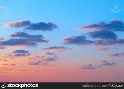 Romantic sunset with beautiful blue, red and yellow clouds.