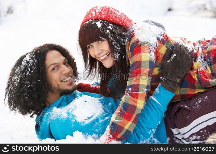 Romantic Teenage Couple Having Fun In Snow