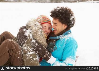 Romantic Teenage Couple Having Fun In Snow