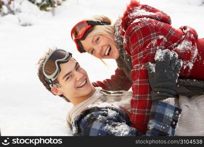 Romantic Teenage Couple Having Fun In Snow