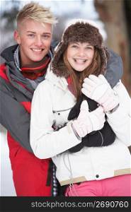 Romantic Teenage Couple In Snow