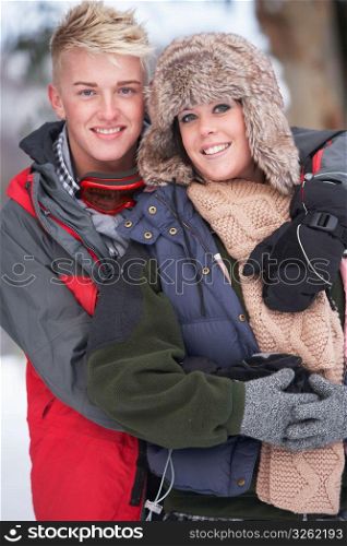 Romantic Teenage Couple In Snow