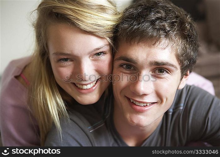 Romantic Teenage Couple Smiling At Camera