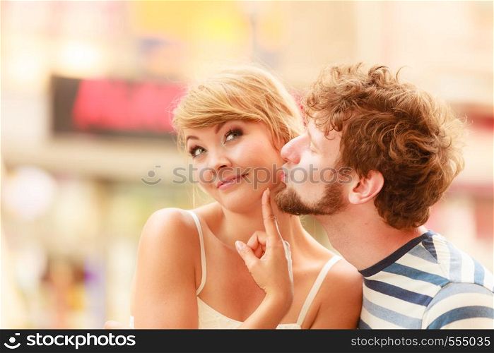 Romantic tourists couple walking in city street. Happy woman and man enjoying life summer vacation outdoor