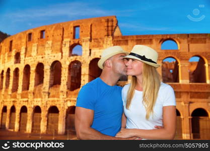 Romantic vacation to Rome, beautiful couple kissing on Colosseum background, happy traveling to Europe, summer holidays concept