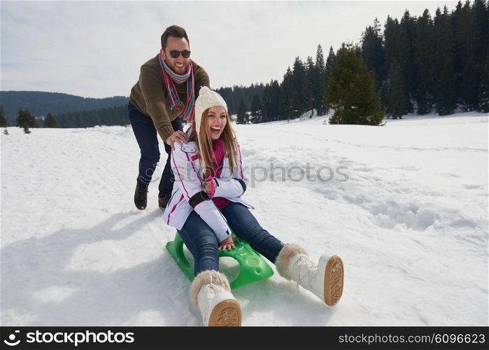 romantic winter scene, happy young couple having fun on fresh show on winter vacatio, mountain nature landscape
