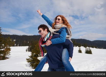 romantic winter scene, happy young couple having fun on fresh show on winter vacatio, mountain nature landscape