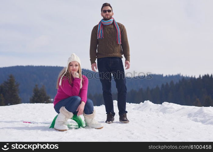 romantic winter scene, happy young couple having fun on fresh show on winter vacatio, mountain nature landscape