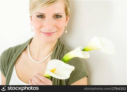 Romantic woman hold calla lily flower on white