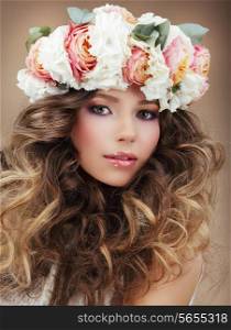Romantic Woman in Wreath of Flowers with Perfect Skin and Frizzy Hair