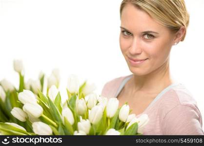 Romantic woman with bouquet of white tulip flowers
