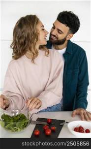 romantic young couple cooking together home