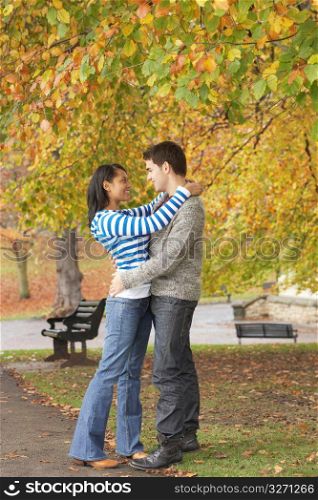 Romantic Young Couple In Autumn Park