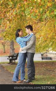 Romantic Young Couple In Autumn Park