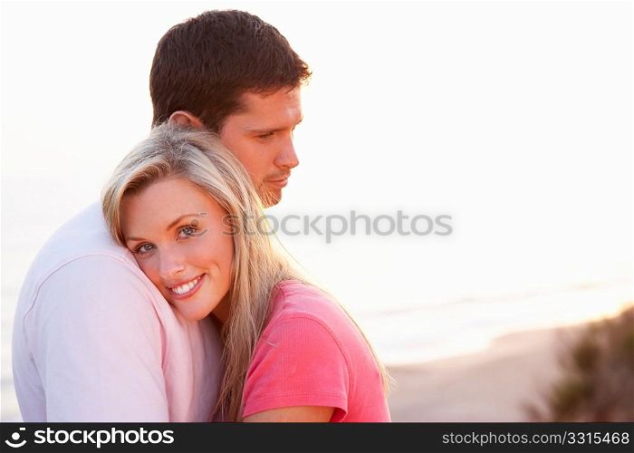 Romantic Young couple in love at sunset