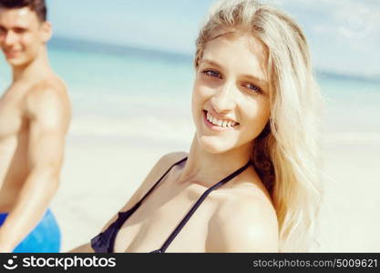 Romantic young couple on the beach. Portraits of romantic young couple on the beach