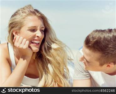 Romantic young couple on the beach. Romantic happy young couple on the beach relaxing