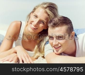 Romantic young couple on the beach. Romantic happy young couple on the beach relaxing