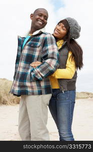 Romantic Young Couple On Winter Beach