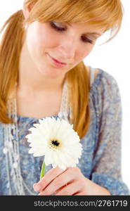 Romantic young woman hold flower gerbera daisy on white