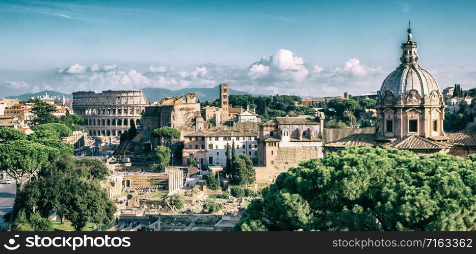 Rome, Italy city skyline with landmarks of the Ancient Rome ; Colosseum and Roman Forum, the famous travel destination of Italy.