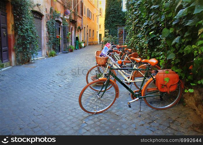ROME, ITALY-December 28 2018: bicycle standing in front of store on old street of Rome .