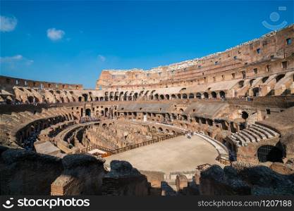 Rome, Italy - Oct 5, 2017: Tourist visit inside of Rome Colosseum in Italy. The Colosseum was built in the time of Ancient Rome. It is one of most popular tourist attractions in Rome, Italy.