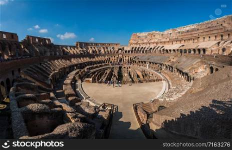 Rome, Italy - Oct 5, 2017: Tourist visit inside of Rome Colosseum in Italy. The Colosseum was built in the time of Ancient Rome. It is one of most popular tourist attractions in Rome, Italy.